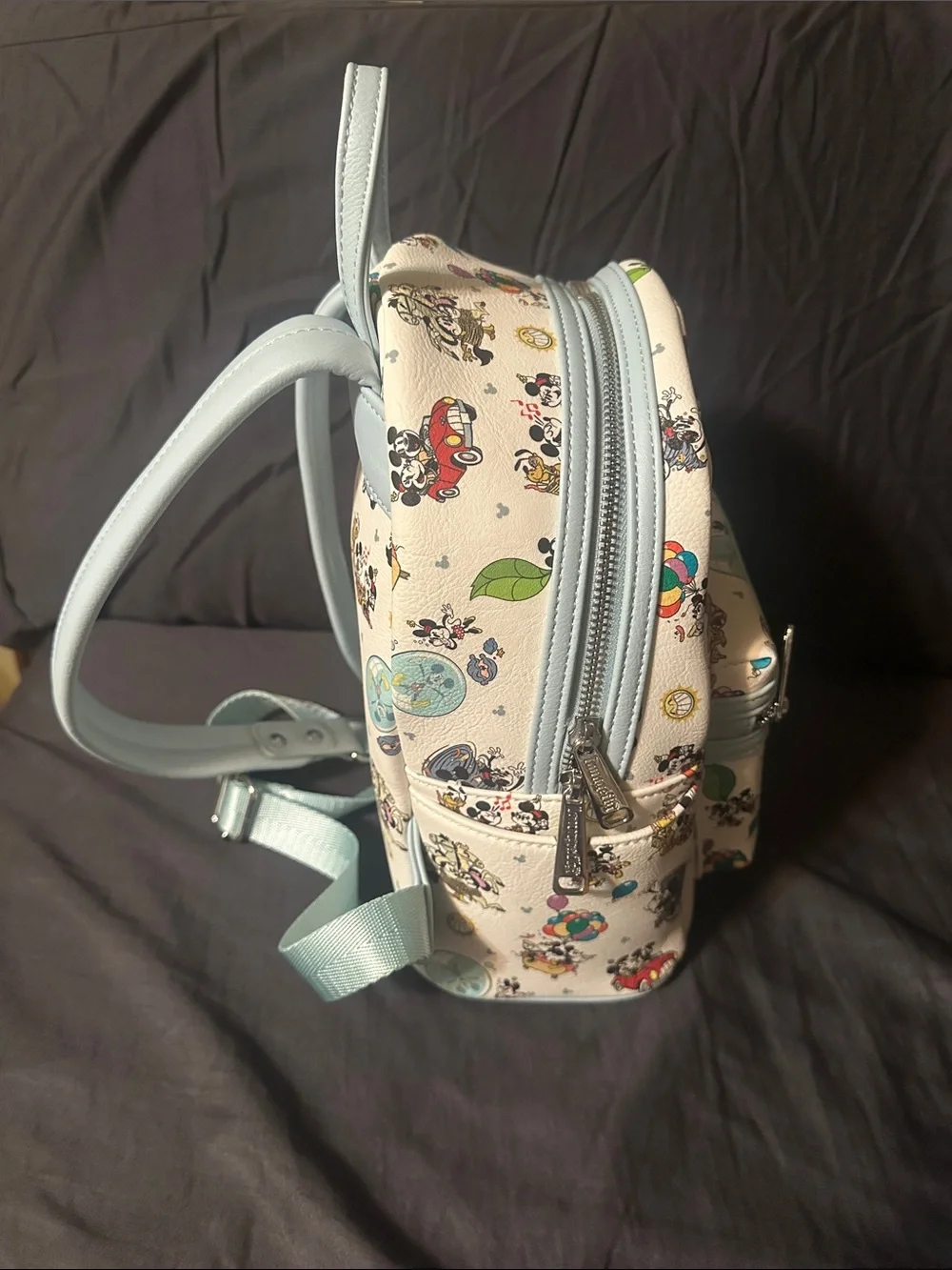 Loungefly Kids Cream Mini Backpack with Light Blue Trim and Disney Print.